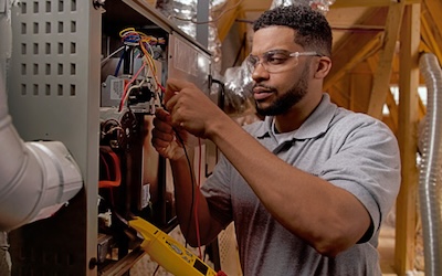 Technician working on furnace